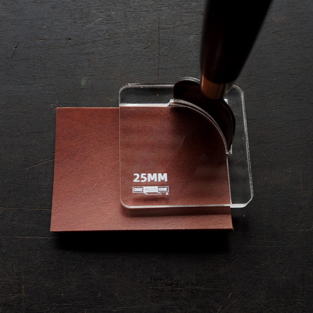 CPT-JIG-25 (Dedicated Jig for 25mm) positioned over brown material for precise corner punch cutting.
