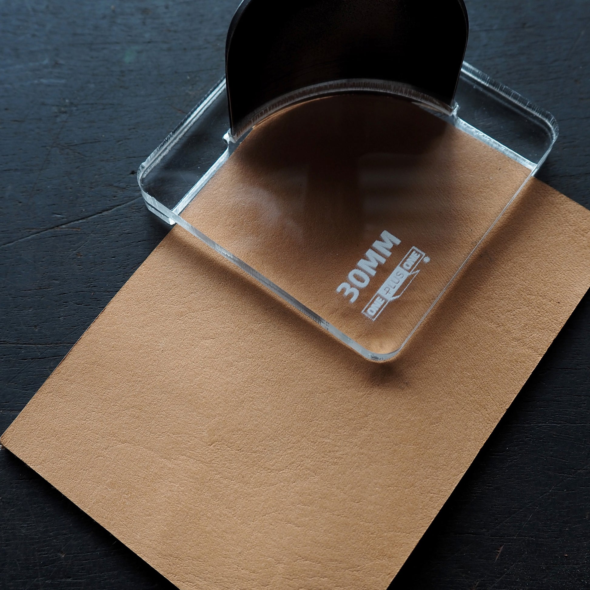 CPT Corner Punch Tool – Full Set positioned over brown paper for crafting projects.