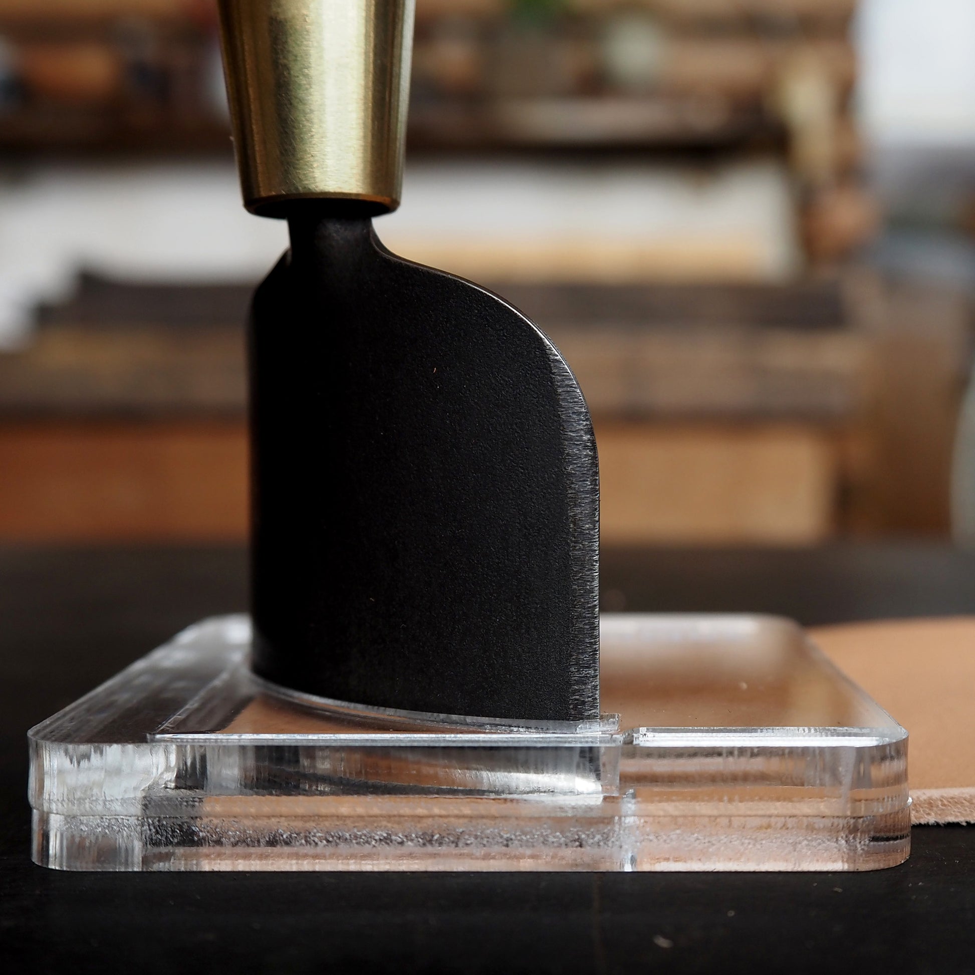 CPT-JIG-30 (Dedicated Jig for 30mm) in use with corner punch tool on a clear acrylic base.